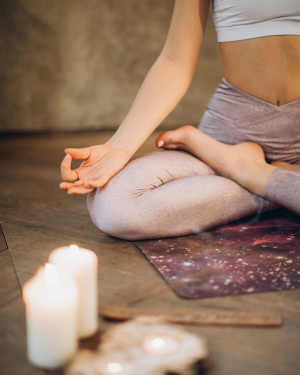 Woman in a calm yoga pose, embodying inner peace and balance.